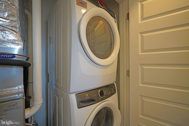 washroom with stacked washer and clothes dryer