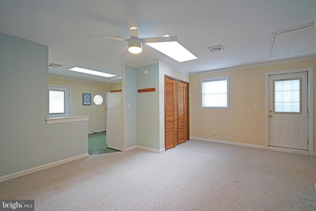 interior space with ceiling fan