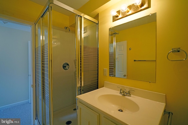 bathroom with vanity and an enclosed shower