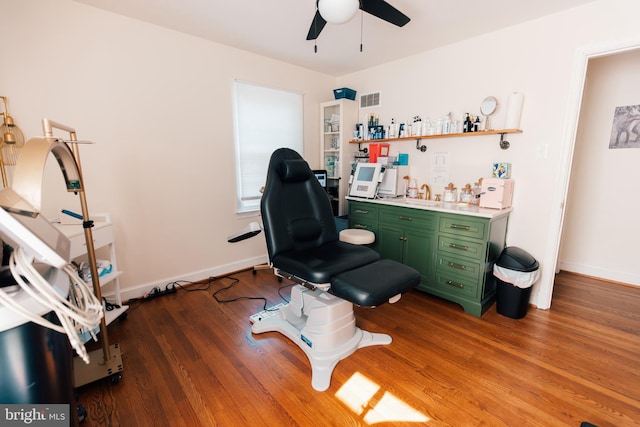 home office featuring light hardwood / wood-style flooring and ceiling fan