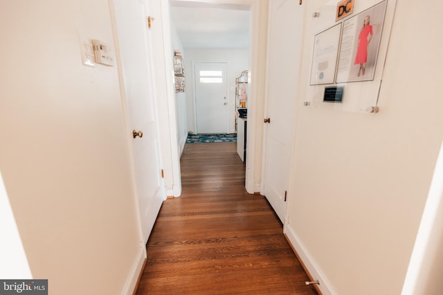 hall with dark wood-type flooring