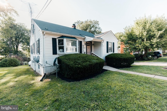 bungalow with a front lawn