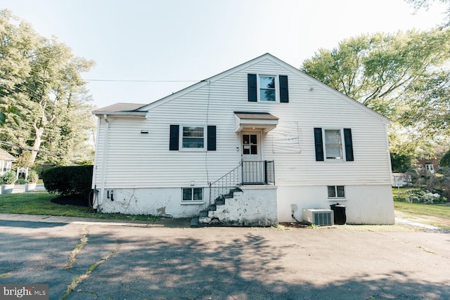 view of front of house featuring cooling unit