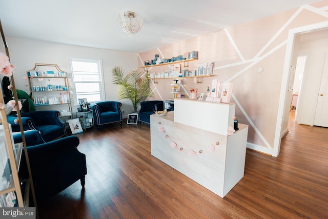 interior space featuring dark wood-type flooring and a chandelier