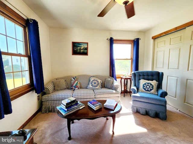 living room featuring ceiling fan and carpet floors