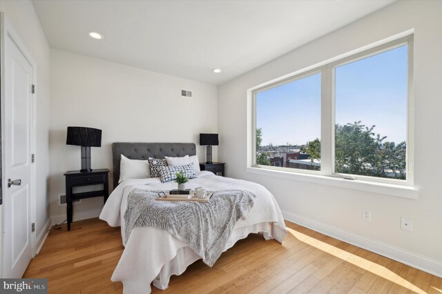 bedroom with wood-type flooring