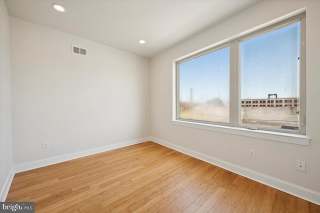 unfurnished room featuring light wood-type flooring