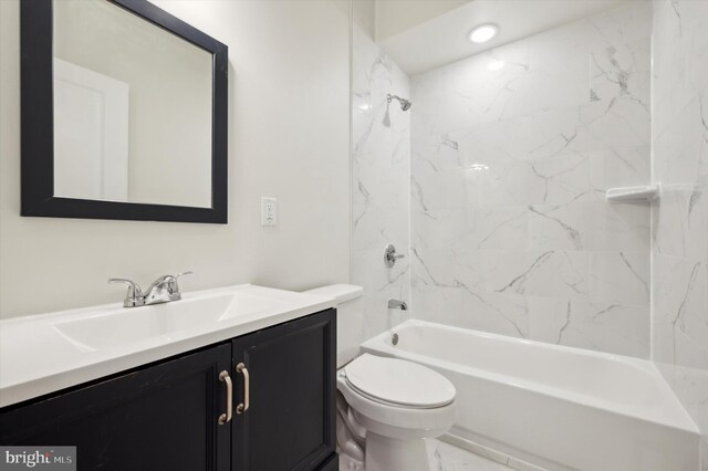 full bathroom with vanity, toilet, and tiled shower / bath combo