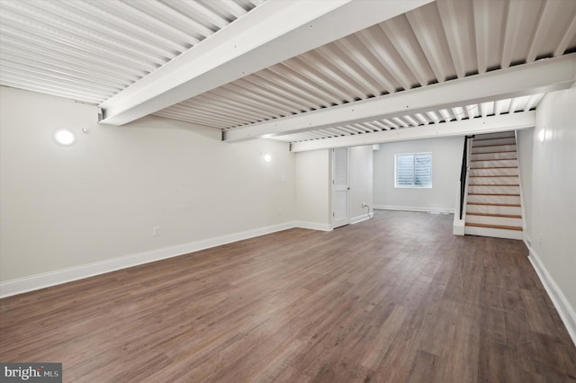 basement with dark hardwood / wood-style flooring