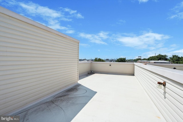 view of patio featuring a balcony