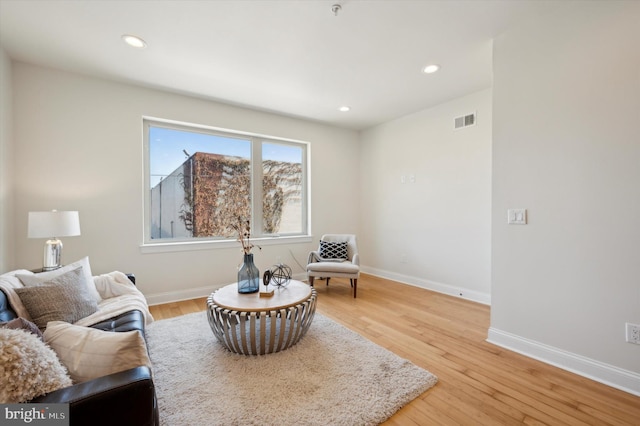 living area with light hardwood / wood-style floors