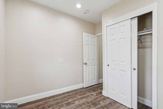 unfurnished bedroom featuring hardwood / wood-style flooring