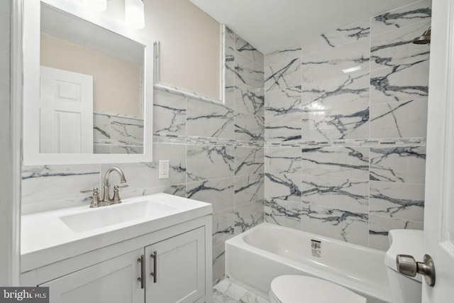 full bathroom featuring vanity, tile walls, toilet, tiled shower / bath, and decorative backsplash