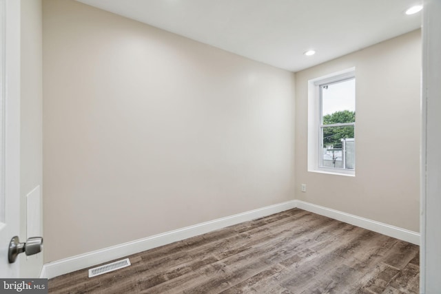 unfurnished room featuring wood-type flooring