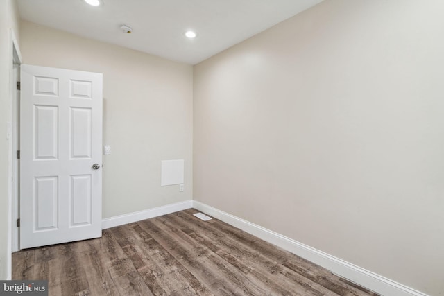 empty room with wood-type flooring