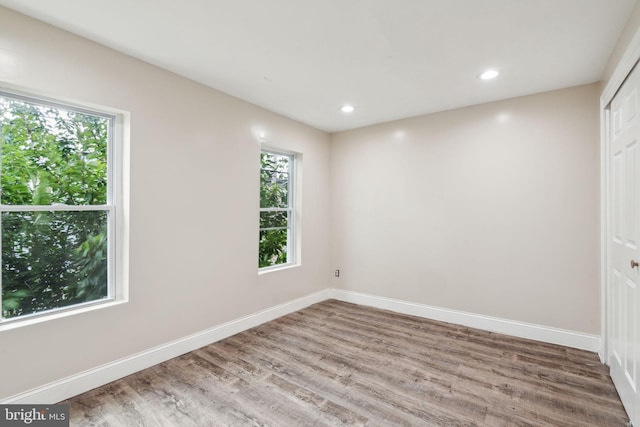 empty room featuring wood-type flooring