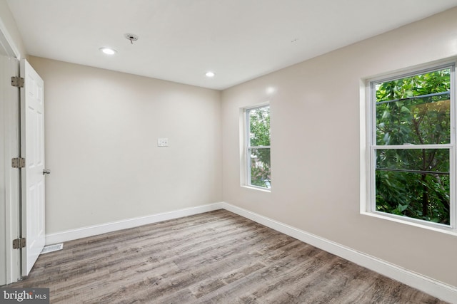 empty room with wood-type flooring