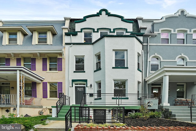 view of property with covered porch