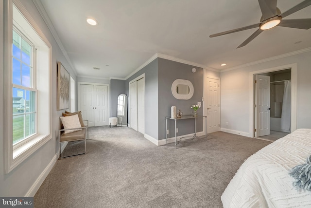 bedroom with ceiling fan, ornamental molding, carpet, and baseboards