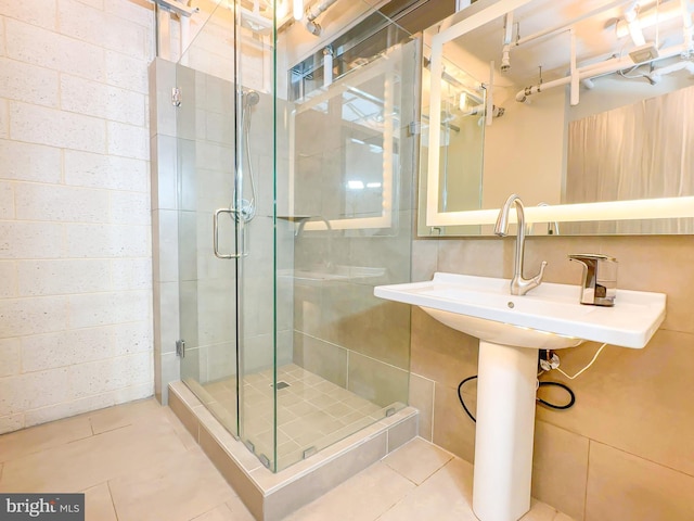 bathroom featuring tile patterned flooring and walk in shower