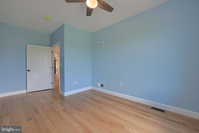 spare room featuring ceiling fan and light hardwood / wood-style floors