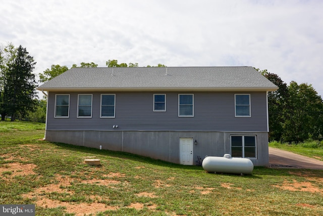 view of side of property featuring a yard