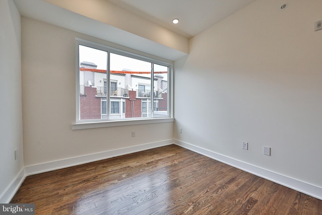 empty room featuring dark wood-type flooring