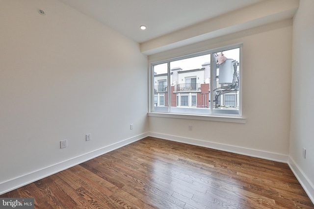 unfurnished room featuring wood-type flooring