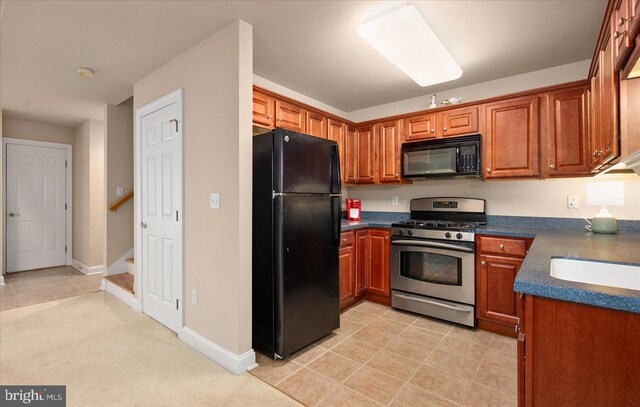 kitchen featuring black appliances and light tile patterned floors