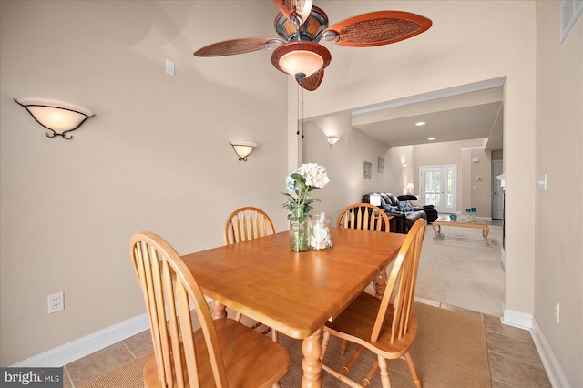 tiled dining room with ceiling fan