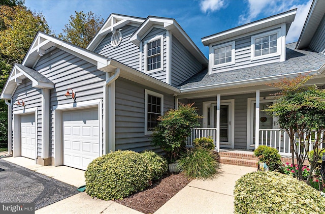 view of front of home featuring a garage and covered porch