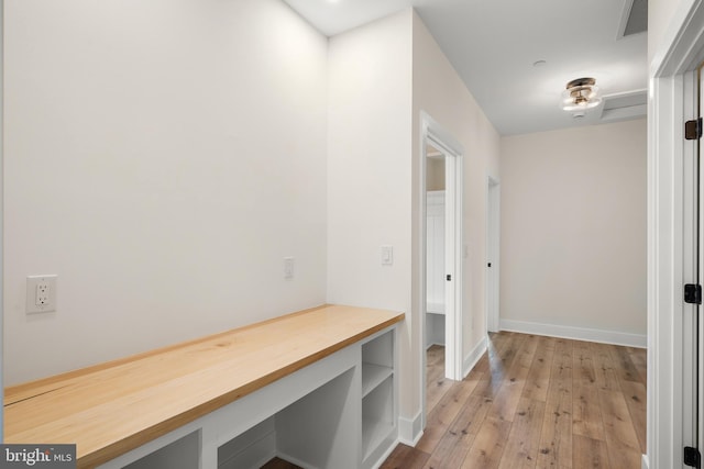 mudroom with hardwood / wood-style flooring, baseboards, and visible vents