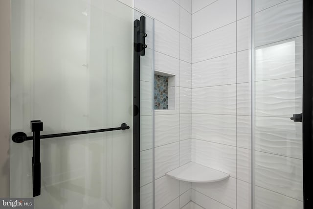 bathroom featuring a shower stall