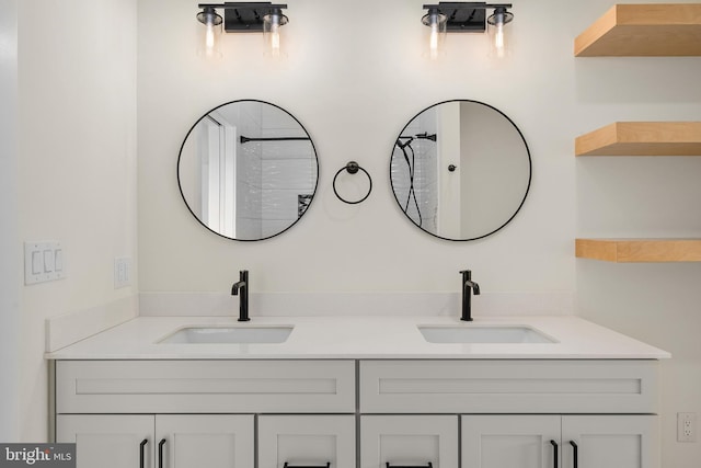 full bath with double vanity and a sink