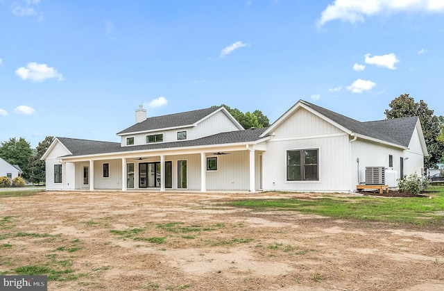 rear view of house with central AC and a patio