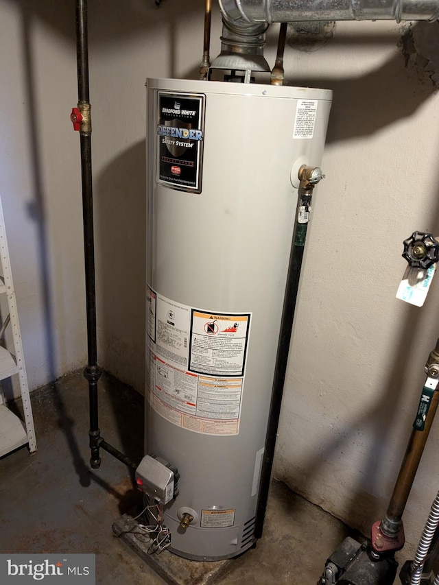 utility room featuring gas water heater