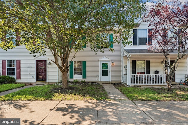 townhome / multi-family property with covered porch