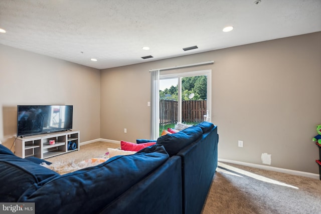 carpeted living room featuring a textured ceiling, recessed lighting, visible vents, and baseboards