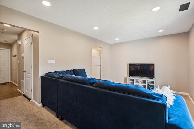 living area with baseboards, carpet floors, and recessed lighting