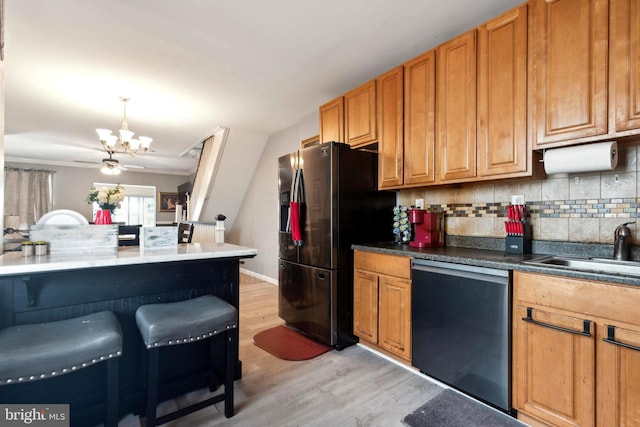 kitchen with stainless steel dishwasher, light hardwood / wood-style flooring, an inviting chandelier, decorative backsplash, and refrigerator with ice dispenser