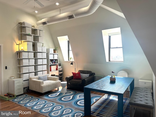 living room with hardwood / wood-style floors and ceiling fan