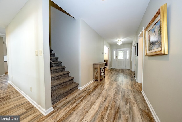 entryway with wood-type flooring