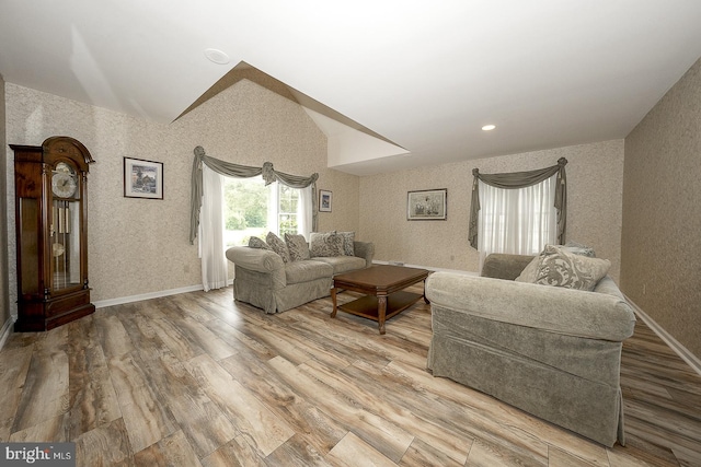 living room with lofted ceiling and wood-type flooring