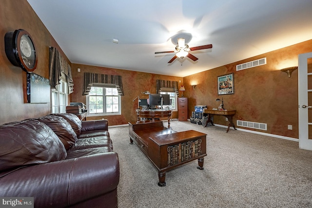 living room featuring light carpet and ceiling fan