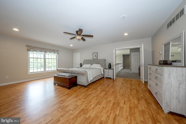 bedroom with light hardwood / wood-style floors and ceiling fan