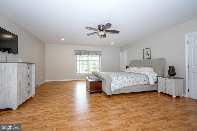 bedroom featuring ceiling fan and light hardwood / wood-style floors