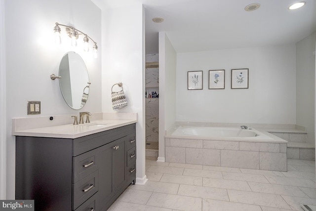 bathroom featuring vanity, tile patterned floors, and independent shower and bath