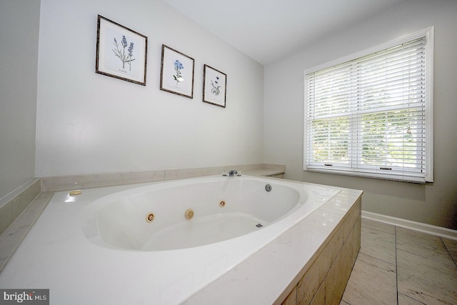 bathroom featuring tiled tub and tile patterned floors