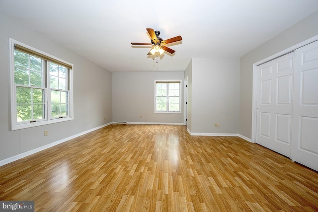 unfurnished bedroom featuring light hardwood / wood-style flooring and ceiling fan