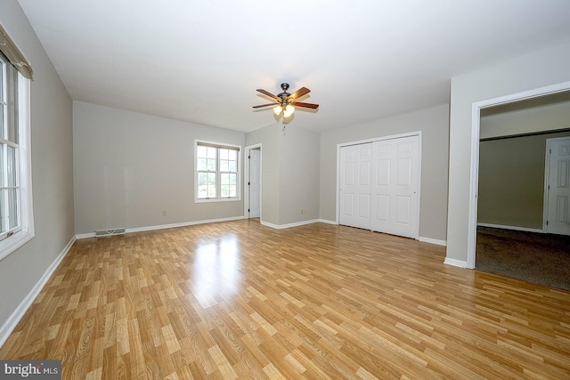 unfurnished bedroom with light hardwood / wood-style flooring and ceiling fan